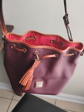 Dooney & Bourke Plum Pebbled Leather Drawstring Crossbody with Tan Trim